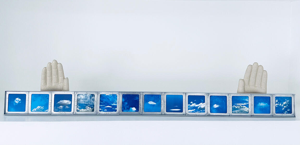 Cloud images mounted into vintage aluminum slide frames